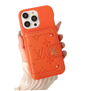 Orange Louis Vuitton leather iPhone case with card holder and monogram pattern.