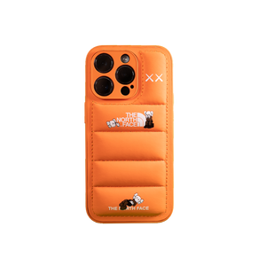 Vibrant orange The North Face x Kaws smartphone case with signature artwork detailing